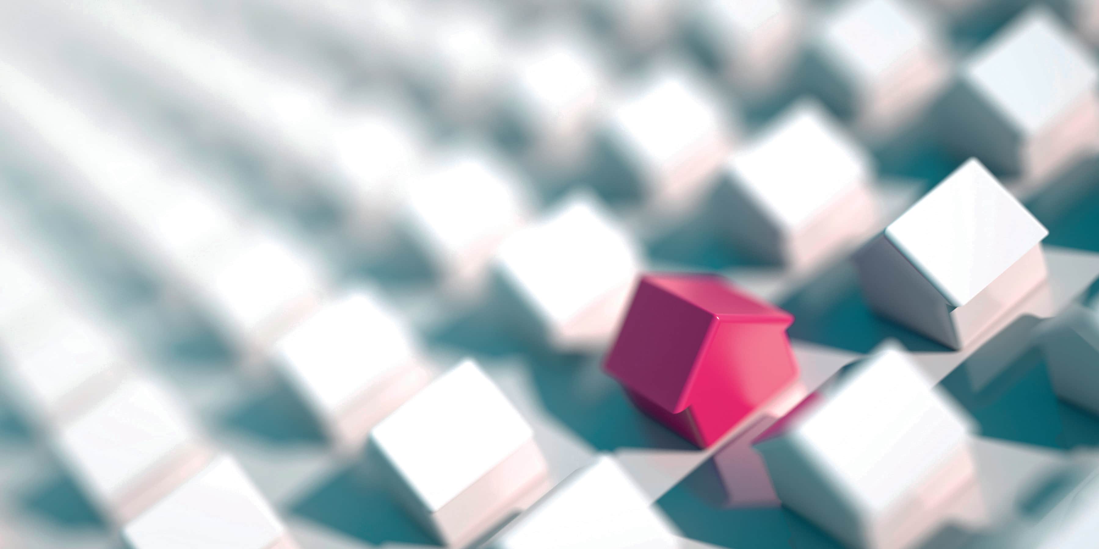 Red model house standing out among rows of white model houses